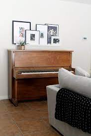 Wall decor comes in all shapes and sizes. A Passed Down Piano Piano Living Rooms Piano Decor Piano Room