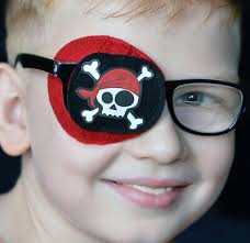 Playful comfortable kids fully obscured eye patch