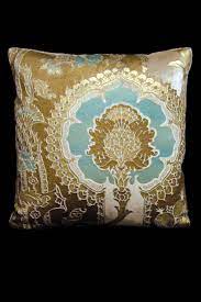 Center features a cartouche with an urn over flowing with flowers & foliage. Light Blue Fortuny