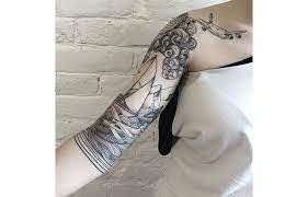 An aesthetically pleasing tattoo enhanced by its cursive font and background of birds. 20 Unreal Half Sleeve Tattoos All Women Will Fall In