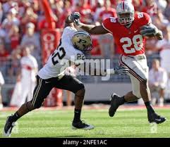 Ohio State's Chris "Beanie" Wells, right, tries to run past Purdue's Dwight  McLean during an NCAA football game Saturday, Oct. 11, 2008, in Columbus,  Ohio. (AP Photo/Jay LaPrete Stock Photo