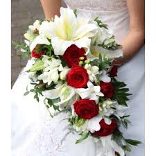 Tight, minimal bouquet of white lily of the valley. Lilly Cascade Bridal Bouquet Deltona Orange City Debary Lake Helen Florist Enchanted Blooms