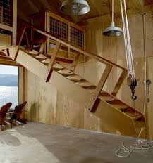 The Stairs Made From Salvaged Wood Can Be Raised With A Block And Tackle To Make Room For A Boat In Winter Garage Stairs Loft Stairs Attic Rooms
