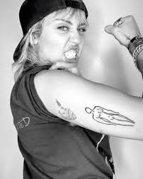 They all like the polynesian tattoo culture/mythos. Miley Cyrus Showed Off Her New Tattoo Of A Naked Woman On Her Arm