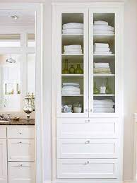Bathroom storage cabinet with glass doors. Investigate Space Between The Bathroom Wall Studs And You Might Discover Hidde Built In Bathroom Storage Bathroom Linen Closet Creative Bathroom Storage Ideas