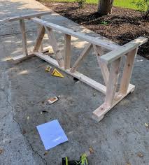 Jake's learning how to use a miter saw. Diy Farmhouse Outdoor Patio Table Made With 2 4 S For Less Than 60 The Frugal Homemaker