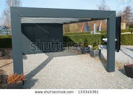 Modern Carport Car Garage Parking Made From Black Metal And Glass By Ron Zmiri Via Shutterstock Modern Carport Carport Garage Diy Carport