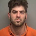 Man charged with holding pair against will, threatening to kill them