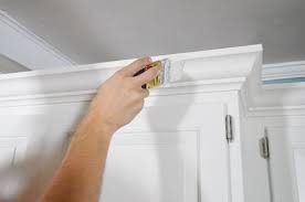 Crown molding that sits atop kitchen cabinets gives them a solid, finished look. How To Add Crown Molding To The Top Of Your Cabinets Young House Love Kitchen Cabinet Crown Molding Kitchen Cabinet Molding Cabinet Crown Molding