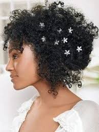Low curly bun with loose curls. Curly Hair Natural Hair Favorites The Messy Bun More Sexy Looks