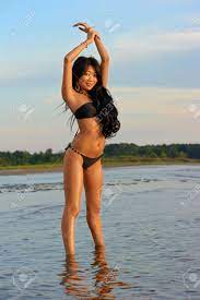 Sexy Asian Girl In Bikini Playing At Beach Stock Photo, Picture and Royalty  Free Image. Image 10790864.