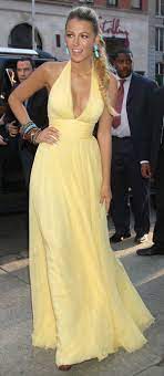 Beautiful young girl wearing black elegant dress standing in the street. Blake Lively Braid Fashion Dresses Blake Lively Style