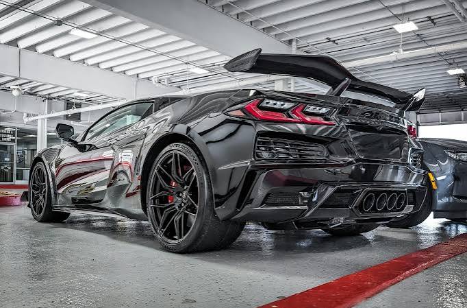 Black sports car in garage