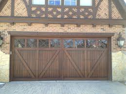 Wood Carriage House Garage Door Tudor Garage Door Www Garagedoorwebsite Com Carriage Style Garage Doors Garage Door Design Garage Door Styles