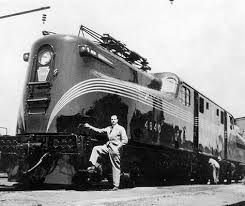 raymond loewy stands next to his masterpiece the gg1 electric locomotive raymond loewy train