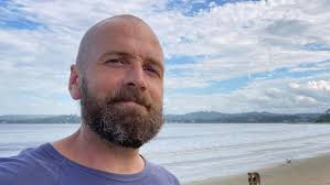 Yeppoon dad Dan Rutledge in coma in Brisbane hospital after stroke  following brain surgery