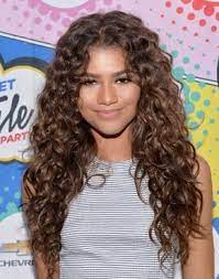 25 Celebrity Brunettes To Inspire Your Next Dye Job Zendaya Hair Brown Curly Hair Curly Hair Styles