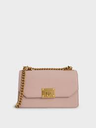 I bought charles and keith bag from the mall of india because i thought that since its a foreign company the quality of the bags would be good but it wasnt. Pink Metallic Push Lock Crossbody Bag Charles Keith Id