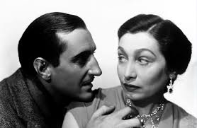 See the link below in the Comments section to view the film.** Wealthy  Aline MacMahon is right to give suave Basil Rathbone the side-eye in the  1935 proto-noir Kind Lady. He is