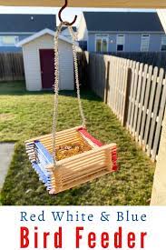 Popsicle stick swing bird feeder. Popsicle Stick Bird Feeder Craft