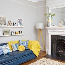 Paint orange and your living room will turn into a warm, informal place. Neutral Living Room With Blue Sofa Decorating Ideal Home Blue Sofas Living Room Blue And Yellow Living Room Living Room Grey