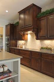 Custom cabinetry unlimited options $4979.00 for 10 x 10 kitchen rustic knotty alder door 12 month special financing apply today for your cabinet pro supply card $5325.00 for 10 x 10 kitchen frameless contemporary styles available in exotic wood species. Burrows Cabinets Kitchen In Knotty Alder Georgian Vent Hood