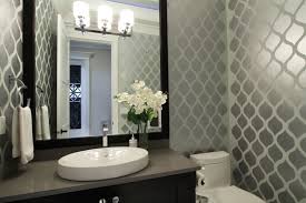 By keeping the walls and the vanity simple and neutral, the designer is able to experiment with the shower and floor tiles and create a load of visual interest with this starburst pattern. Make A Statement With Stenciled Walls