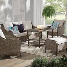 Complete with two ottomans, two armchairs and one accent table to give your patio or deck a warm and inviting feel, the set flaunts tightly woven resin wicker for a stylish look. Wicker Patio Furniture Outdoors The Home Depot