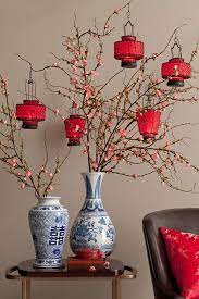 Ancient chinese gold ingots, called sycees, were long and curved up at the ends, shaped vaguely like a boat. 13 Stylish Chinese New Year Decorating Ideas Nuyou Chinese New Year Decorations Chinese Decor Asian Home Decor