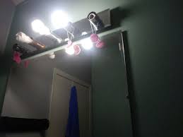 Compare homeowner reviews from 12 top tampa light fixture installation services. Fabric Covering Hollywood Bathroom Light Fixture Fire Hazard Hometalk