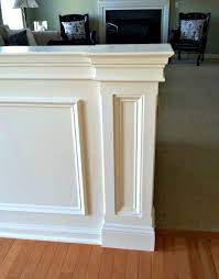 It makes an easy transition between different surfaces and materials. Stephanie King Design Half Wall With Mouldings Laurel Home