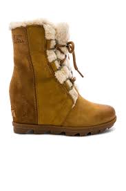 To measure your foot, place your feet flat on a piece of paper and mark your longest. Sorel Joan Of Arctic Wedge In Camel Brown Revolve