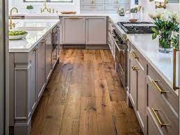 Solid hardwood flooring is a highly attractive, premium building material that has undeniable prestige. Pros And Cons Of Flooring Laminate Vs Hardwood Kitchen Remodel Kitchen Flooring Options Flooring