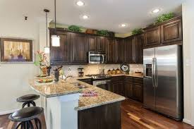 Discover the best things to do & events in dallas. Love The Dark Brown Cabinets And L Shaped Island In The Grayton Model In Dallas Texas Rustic Kitchen Cabinets Home Kitchens Kitchen Cabinet Decor Above