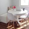 Fancy white round kitchen table with breathtaking white breakfast. 1