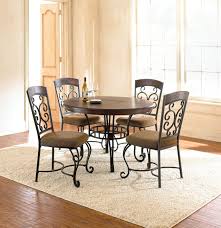 Select a table with a pedestal design which places the legs at the centre instead of along the. Wrought Iron Kitchen Sets Ideas On Foter