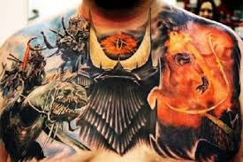This simple tattoo features the ports where the claws would shoot from the skin in grey and black. 13 Comic Book And Superhero Chest Tattoo Designs