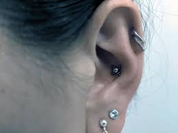 In forward helix piercing, the upper cartilage of the ear, facing forward is pierced. Portfolio Body Vision Piercing