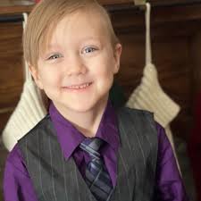 It was dress to impress day at school, for their New Year's celebration!  Coen loves to dress up, so he was so excited about this. He said the purple  gave him Willy