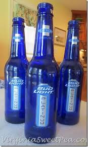 Black And Blue Beer Beer Bottle Centerpiece Yes I Did Sweet Pea Beer Bottle Centerpieces Bottle Bottle Centerpieces