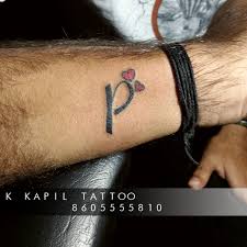 Keep the overall design simple, like this one, for a minimal design that makes a major statement. Uzivatel K Kapil Na Twitteru P Later Small Two Heart Alphabet Black Creative Simple Small Most Tattoo Intez Tattoo Design Black Small Simple Ink Inking Tattooist Tattooart Art Worldfamousink Tattoowork Tattoo Tatt Art Tattoos