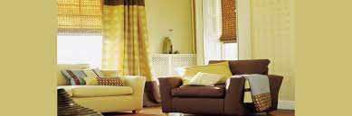 Living room with dark grey wall and yellow curtains and cushions. 5 Curtain Idea For Rooms With Yellow Walls And Brown Furniture
