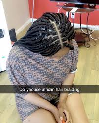 Once you've braided half of the hair, tie the braid upwards to form the updo. Schedule Appointment With Dollyhouse African Hair Braiding