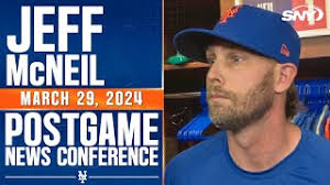 Jeff McNeil reacts to Rhys Hoskins' slide that took him out at second