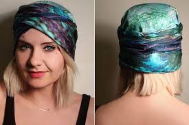 Put the scarf around your head with the ends in the front, making sure the wrong side of the scarf (the part where you can see the folds) is against your head. Ten Very Cool Ways To Tie A Headscarf
