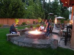 Stone Patio Ideas On A Budget With Round Fire Pit For Impressive Backyard Design Jpg 1024 768 Fire Pit Landscaping Fire Pit Patio Backyard Fire