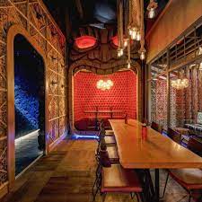 18 Tropical Tiki Bars To Visit This Summer Outdoor Tiki Bar Tiki Bar Tiki