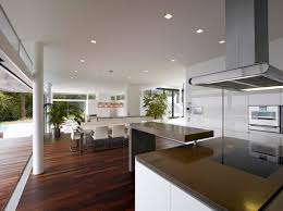 Paneling over the fridge door and minimal upper cabinets keep the look streamlined and clean. Best Contemporary Kitchen Design Viahouse Com