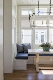 The corner breakfast nook is a great addition to a kitchen or dining room because it can add function, beauty, and it saves space. Concrete And Wood Trestle Dining Table With Built In Bench Cottage Dining Room