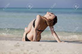 Young Woman With Black Bikini Sexy Girls On The Beach In Water With Blue  Sky In Summer Vacation Фотография, картинки, изображения и сток-фотография  без роялти. Image 15671505